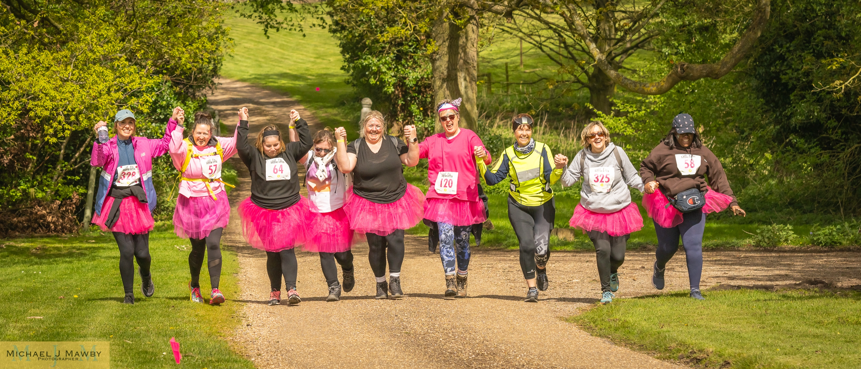 riends running in the Trail Run dressed in Pink TuTu's